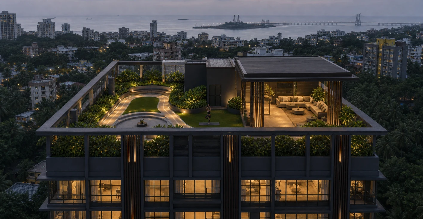 An aerial view of the landscaped rooftop amenity deck at dusk